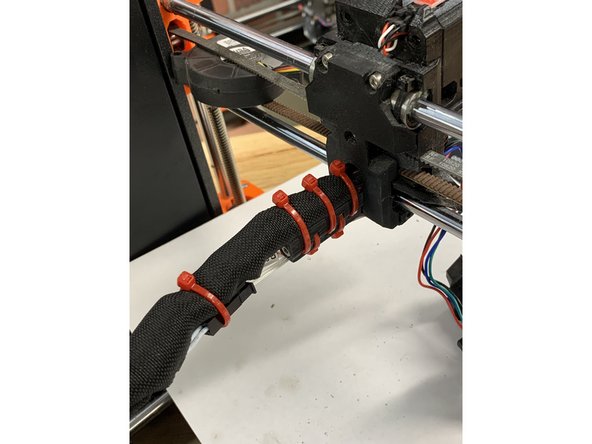 Redress the wire loom into the wrap material and secure with ty-wraps. One additional ty-wrap should be used to secure the two Micro-fit 3.0 connector as shown,