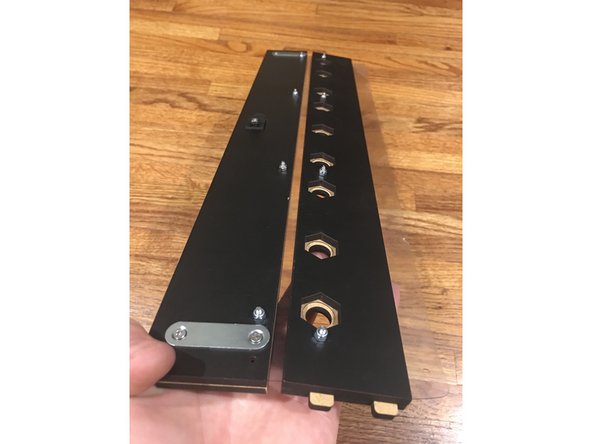 Place the Inner Exit Plate on top of the vinyl, being careful to line up the bolts with the holes as pictured.