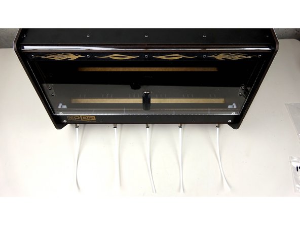 Feed the tube in until it is flush with the inner exit plate (Pic 2)