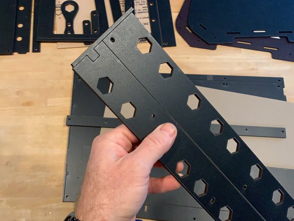 You'll notice that your laser cut panels come tabbed in sheets and zip tied together for maximum protection in shipping. Before getting started remove all the disposable edge tabs at the sides of the panels and separate to easily inventory