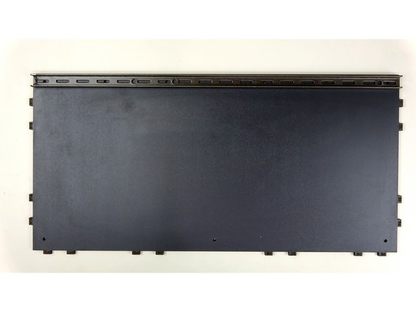 Take the Base Panel and lay it flat on the table with the finished side UP. Place the Steel support beam along the edge of the Base panel that does NOT have any tabs.