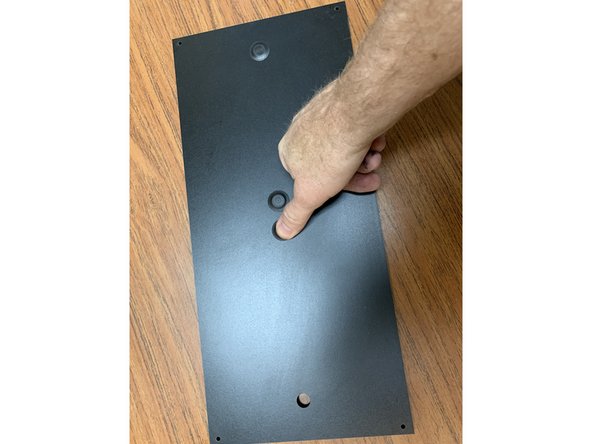 Locate the Rear Panel (Part 4). We'll start by prepping it with its plugs and fittings before we attach it to the box. You can certainly adjust this later but we find it easier to prep for the default setup at this point.