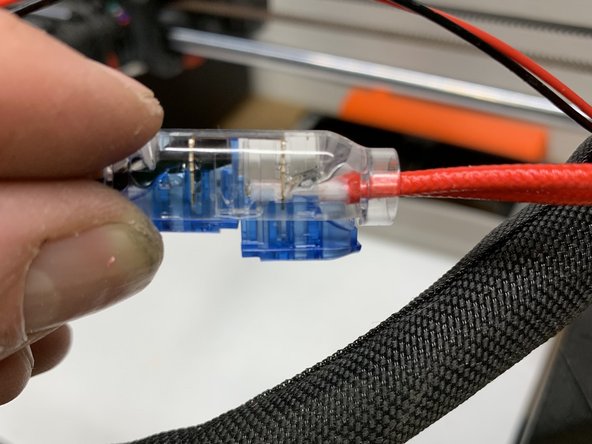 Squeeze one end of the splice down at a time watching as the wire is pressed into the knife edge conductors and compress until each button locks firmly in place. You'll notice the insulation wire being curved and locked in place to support the wire. This is by design.