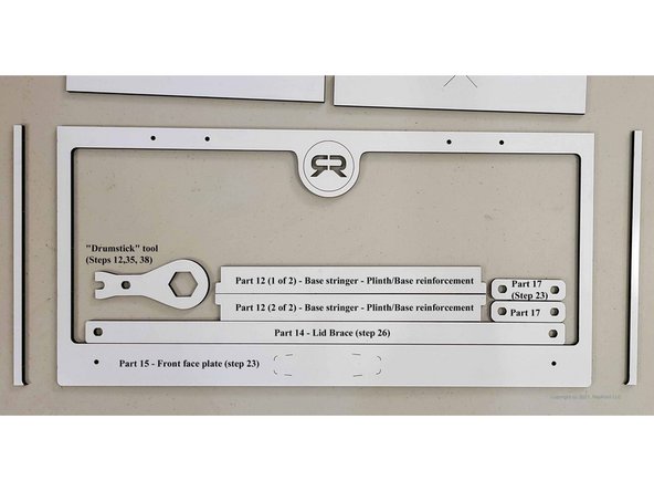 There two parts marked 'X' are not used.  The piece directly surrounding the drumstick tool and other parts is also not used, but the one outside of that, Part 15, is the Front Face Plate, and that part is used.  The second image shows more clearly what to keep.