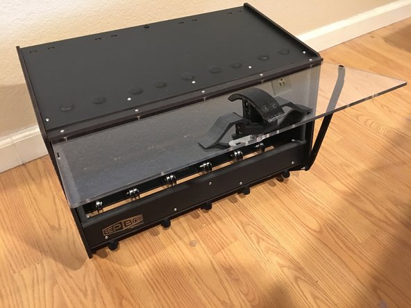 To secure the lid open simply grab the top of the prop and pull away from the box slightly and place into the small notch cut out of the acrylic lid.