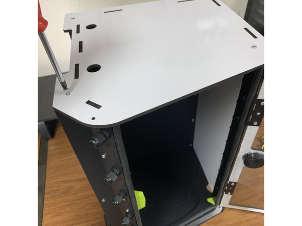 Remove the four screws that are holding the other side panel to the box and then remove ONLY THE OUTSIDE SIDE PANEL. NOTE: Your outside side panel may look different depending on what version of the RepBox you ordered. 