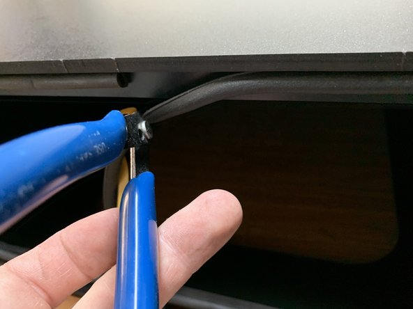 Cut any excess seal gasket with scissors or flush cutters so the gasket lines up with the starting edge at the top center of the Seal Flange where you started.