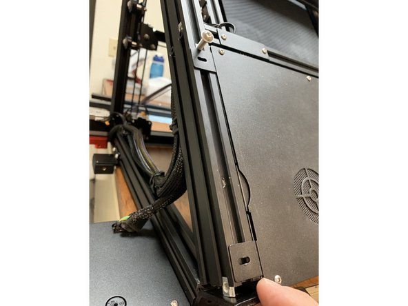 Re attach the screws holding the electronics tray in place