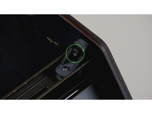 If you have not done so yet, insert a nylock into the L bracket that is seated against the side panel.