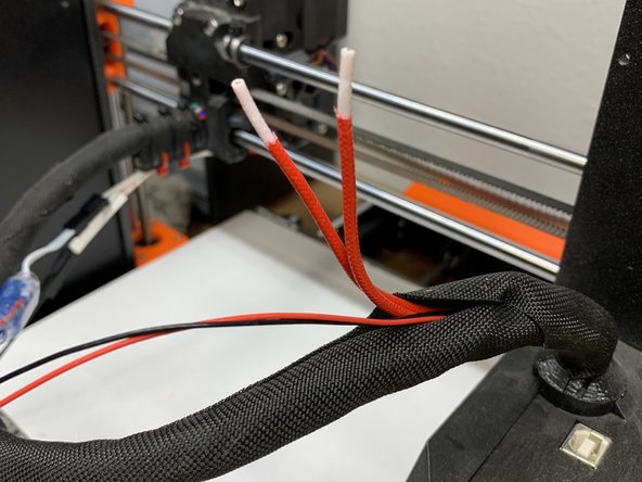 Cut the stock wiring for the thermistor and the heater to line up with where the other end of the splice connector will be and strip 1 inch off ONLY the outer red cloth jacket of the heater wire. The white silicone insulation MUST remain on the heater wire for a proper splice.