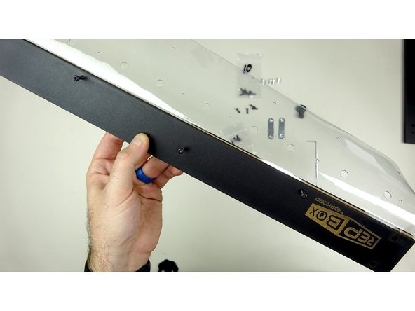 Standard Kit: Insert Three , 14mm bolts through the smaller holes. They should be inserted from the front (panel with logo) to the back. The Pan heads of the bolts should be on the logo side.