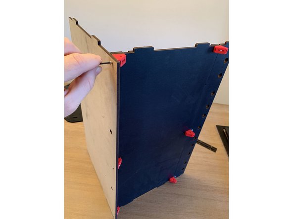 Turn the assembly on end as shown in pic 2 to run the fasteners through to seat in the nuts you pressed into the bottom corner of the brackets earlier.