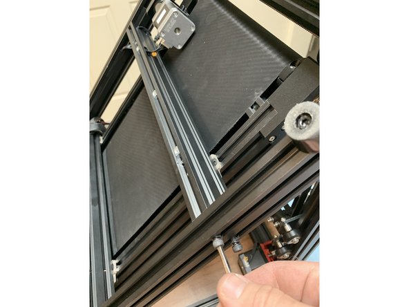 Fasten the side bolts and the top bracket nut that you removed in earlier steps to free the extrusion.