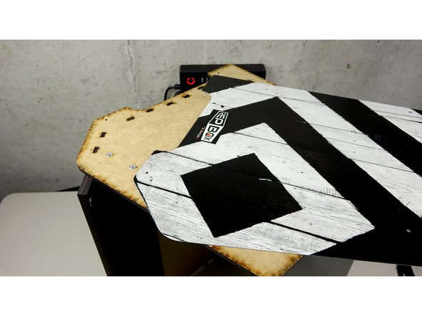 Carefully Flip over the assembly to where the attached side panel is up.