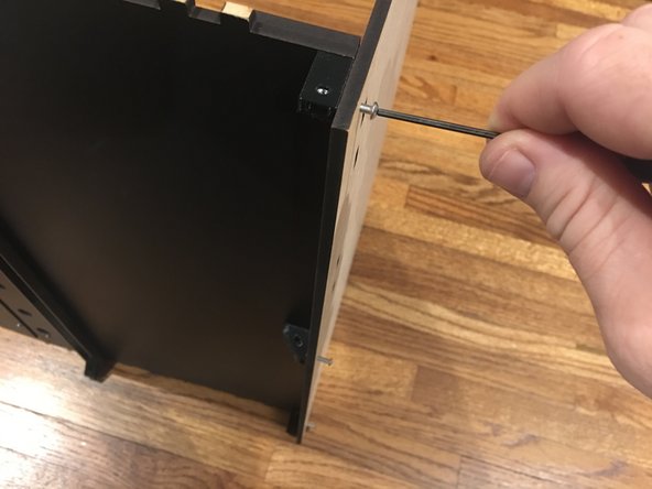 Carefully stand the whole assembly upright, with the base panel on the table.