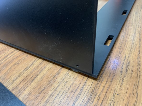 Grab one of your two side panels (Part 2) and lay it onto your Base panel assembly as shown in picture 1.