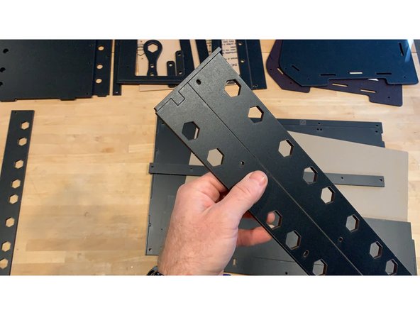 You'll notice that your laser cut panels come tabbed in sheets and zip tied together for maximum protection in shipping. Before getting started remove all the disposable edge tabs at the sides of the panels and separate to easily inventory