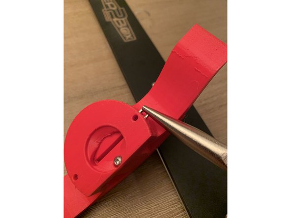 The latch mechanism pictured is only included with the seal kit. If you do not have the seal kit simply press fit the square nuts into the side of the lid handle and proceed to the next step.