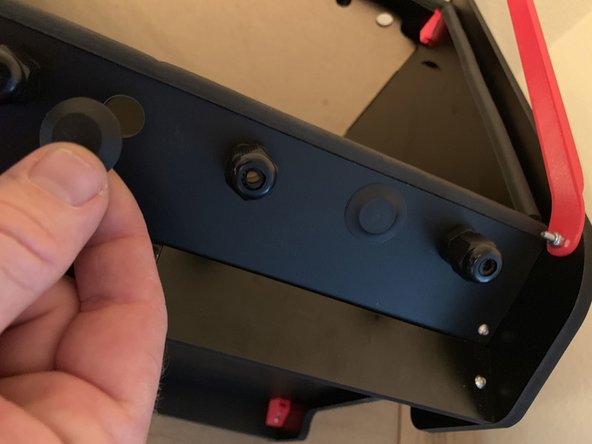 If using the 3D Printed lid props attach to BOTH sidepanels using a 16mm screw and a nylock as in pic 1. They should bolt to the INSIDE of the panel with the flange laying over the edge of the sidepanel. If using the provided steel prop simply pick which side works best for you.
