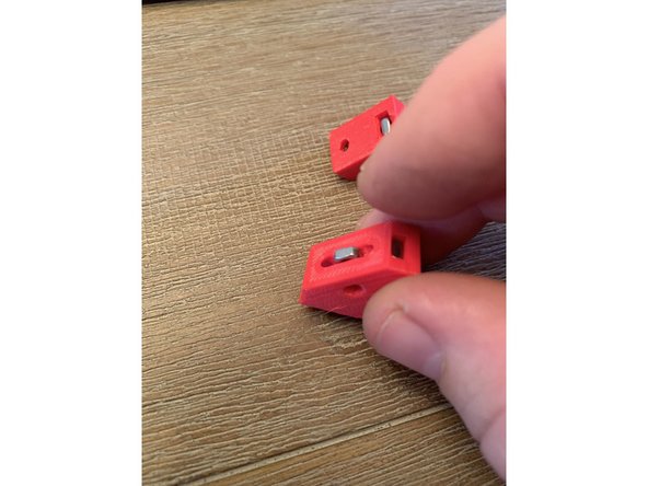 Start by orienting all 6 brackets as shown in image 1. Press in one square nut on the top corner as shown in pic 1 and one in the corner slot directly beneath it as shown in pic 2. Do this for all six base brackets.