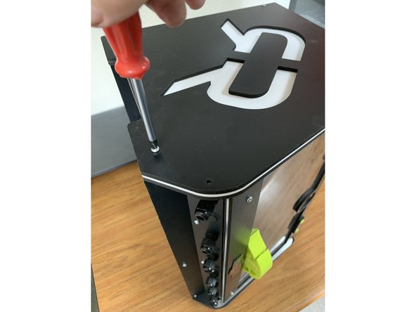 Remove the four screws temporarily holding the exposed inner side panel to its brackets.