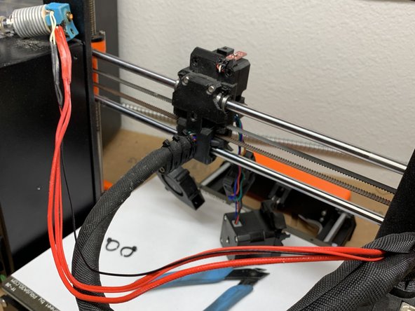 Disassemble and remove the stock v6 hot-end package per official E3D instruction steps 1-7.