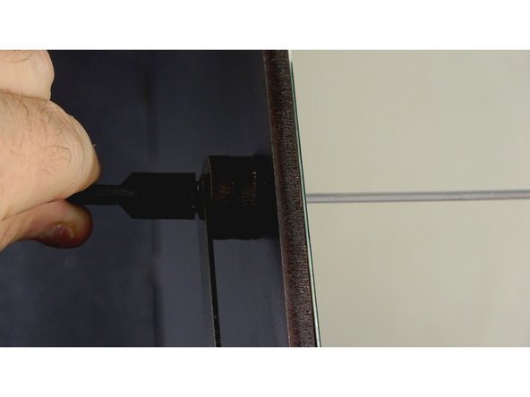 Place a nylock nut on the bolt and tighten down just enough to make contact with the arm.