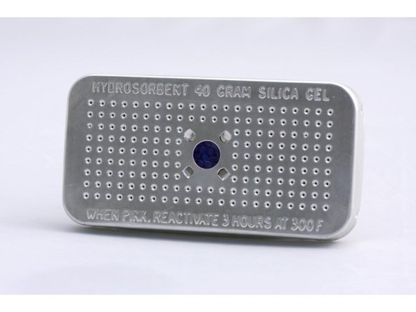 Place the rechargeable desiccant cartridges in between the rollers on the center track, or on the front exit panel if you're not using it for exits.