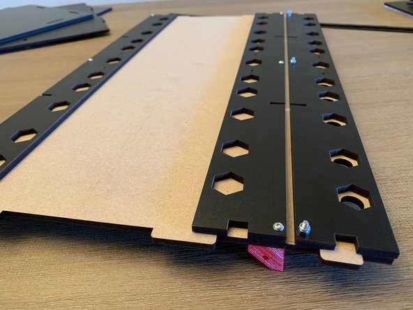 Pic 1: Exit panel assembly shown from the top with the nylocks holding the front exit panel to the rear with the nylon sandwiched between.