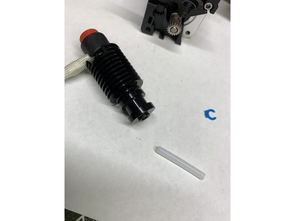 Insert the precut tube into the heatsink and secure with the clip provided.