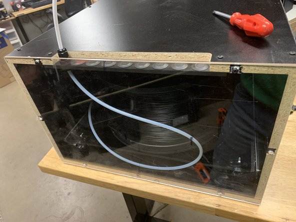 IMG 1 - Install x1 Exit Fitting into the Brake/Tower Assembly. Feed the PTFE Tube through the Exit Fitting leaving approx. 2-3 inches (50-75mm) sticking through towards the front. Tighten the Exit Fitting Cap to secure the tube.