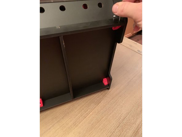 Remember the oval holes seen at the corners where the brackets attach to the side panels? Nows the time to use them.