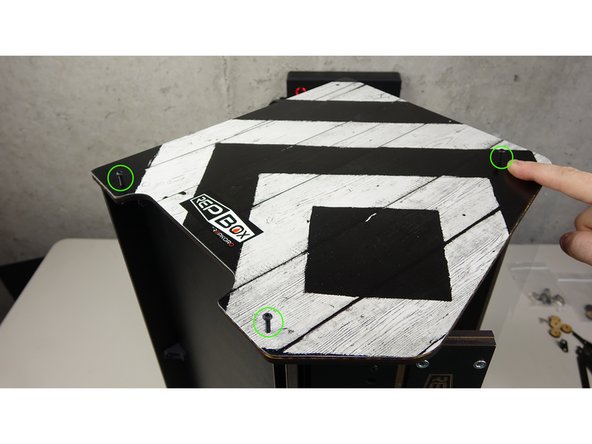 Place the remaining side panel assembly on top, carefully pressing in all the tabs into the slots as you go.