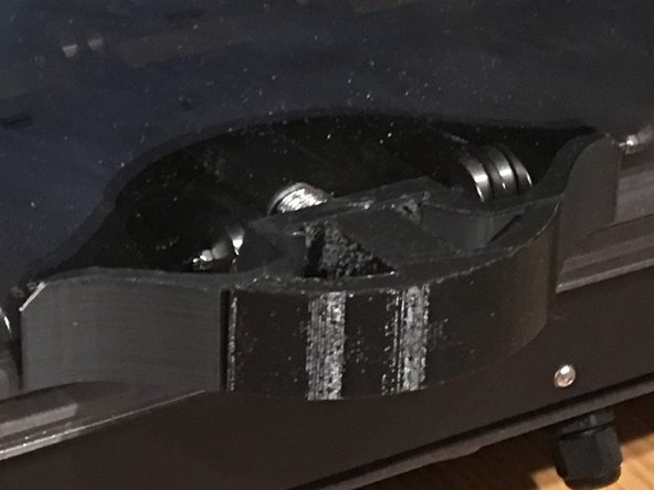 Press one of the plugs over the exposed center hole to cover the hole in the handle and acrylic.