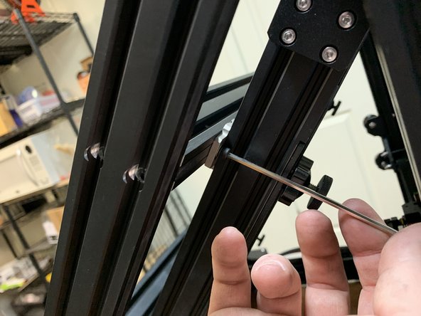 Start by removing the screws holding it to the side rail. You can do this on either side, the process is the same.