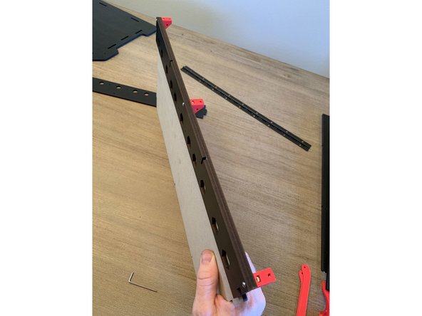 The rear track guide bolts to the rear of the base panel in the same manner as the front but without the vinyl strip sandwiched between as was done with the front side. This is shown in pic 2.