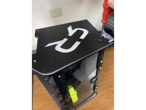 Start by laying your RepBox on its side so that the side panel that has the lid prop installed on it is touching your work surface.