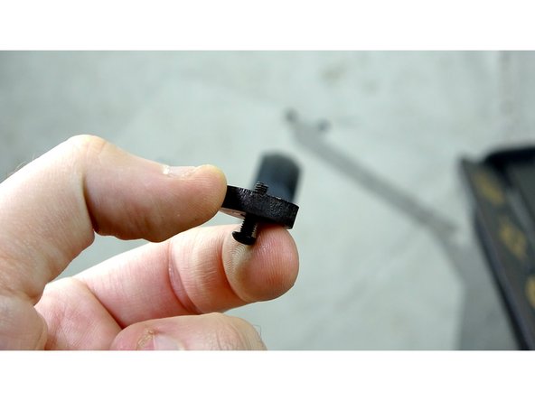 Put the handle that comes with the seal kit into the top large hole in the acrylic.