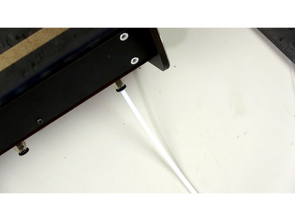 Insert one PTFE tube (with reamed side going IN TO the box) in and through each of the Pneumatic fittings.