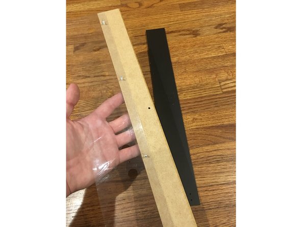 Place the Outer Face plate (with Repkord logo) on TOP of the Large Vinyl Hinge as pictured. Make sure to note proper hole alignment. The vinyl sheet is cut so that only one side lines up correctly with the holes in the panel.