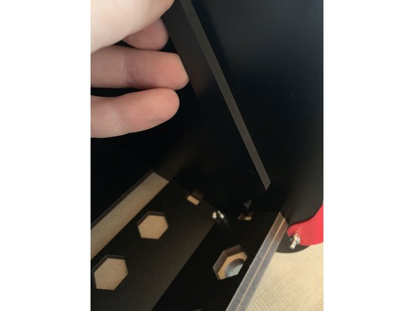 Place the key at the base of the seal bar into the notch at the edge of the interior exit panel as shown in pic 2.