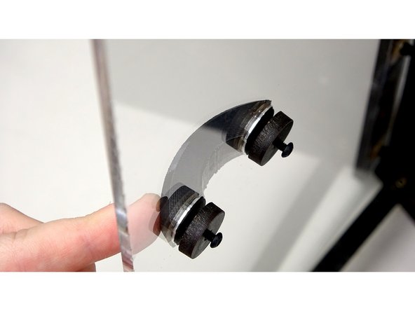 Place the handle into the holes of the Acrylic lid.