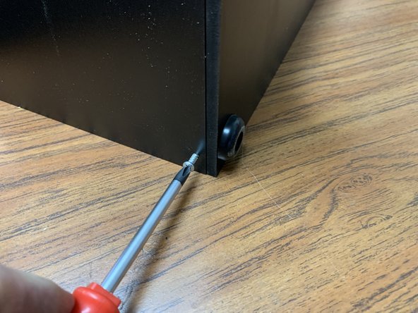 As mentioned in the earlier prep step, double check the orientation of the rear panel.  If the rear panel holes are offset from center, attach the panel so that the holes are nearer to the base.