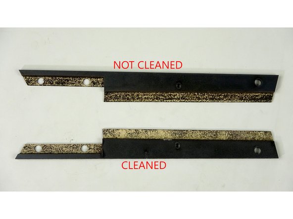 Use your craft knife or sandpaper to clean off as much of the carbon build up as you can, without taking chunks out of the wood.