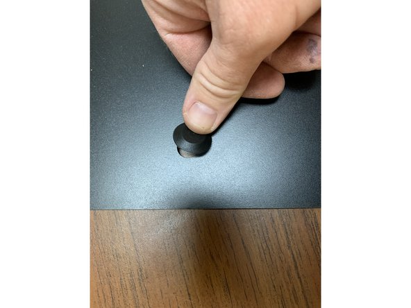 Remove three Exit Plugs (Part 14) from the Parts Pack and press them into three of the four holes in the rear panel, leaving one closest to the edge open for our Exit Fitting.