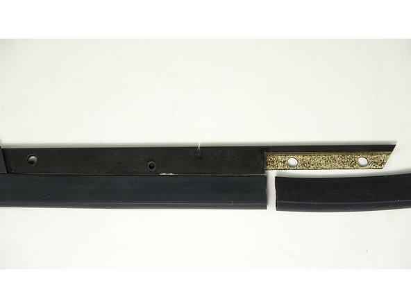 Place the exposed adhesive Lip of the P Gasket on the lip of the bar, making sure of proper orientation (check against pic 2 or 3)