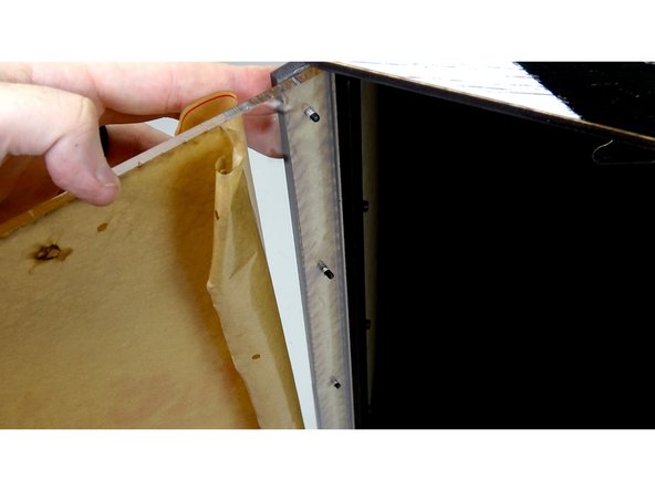 Take the Acrylic Clamp panel and line it up with the vinyl on top of the box.