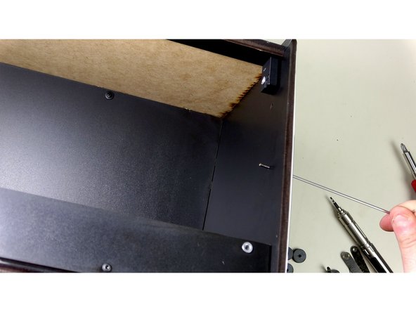 Insert a 25mm Bolt through the right Graphic side panel and the Seal bar(not pictured), to the inside of the inner compartment.