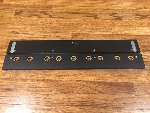 Insert four, 16mm bolts through the plate and through the vinyl sheet.