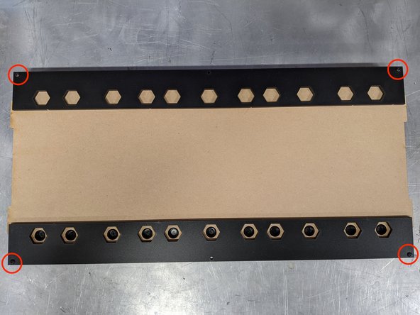 Grab both outside track guides (Part 2) and line up on either end so the 3mm holes at the edges line up with the ones on the base panel.